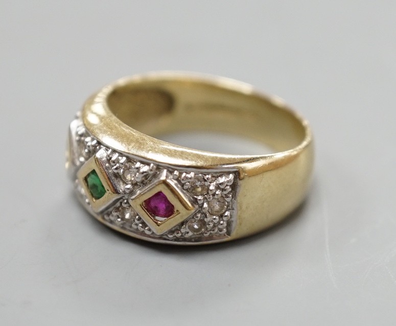 A modern 375 yellow metal and four colour cubic zirconia set dress ring, size O, gross weight 4.6 grams.
